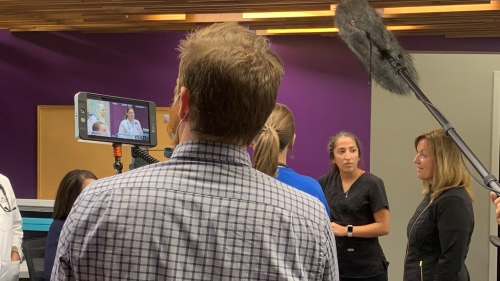 Students, staff, and faculty from Minnesota State Mankato, as well as providers with Mayo Clinic Health System, with film crew filming parts of the documentary in the public dental clinic lobby