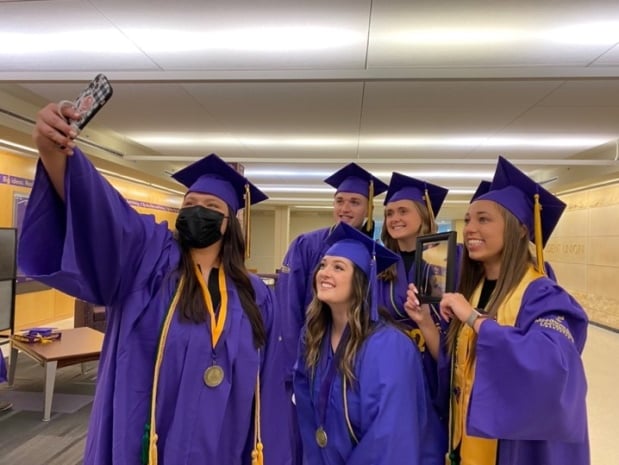 a group of people wearing graduation caps and gowns