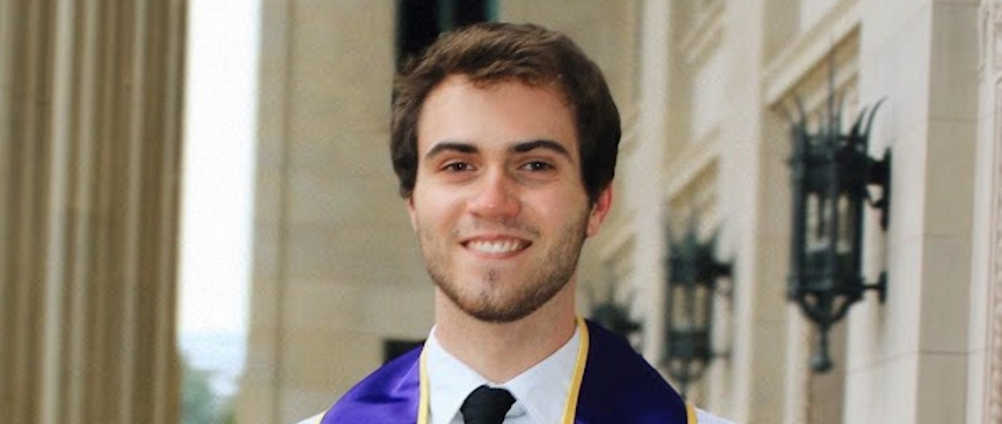 a person wearing a graduation gown