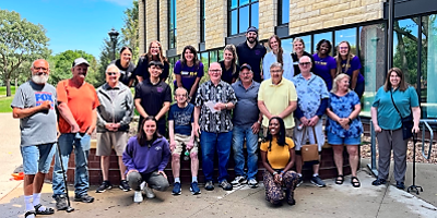 Aphasia group photo of participants posing outside of Minnesota State Mankato