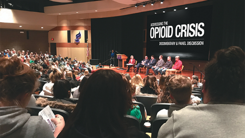 People gathered in the auditorium for opioid crisis event