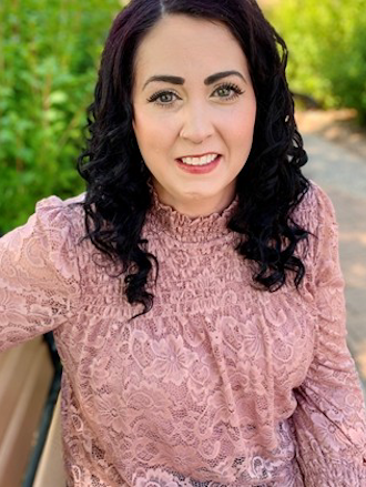 Woman sitting on a bench and smiling