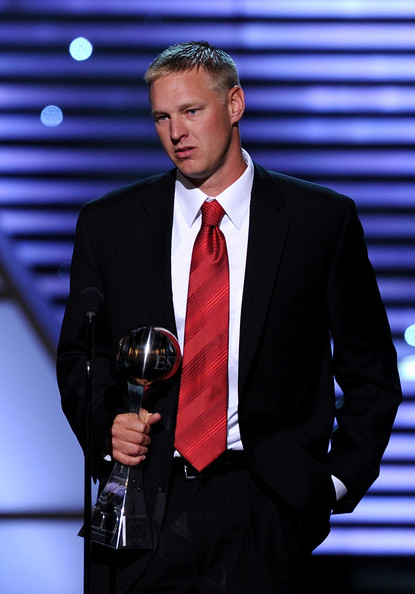 Aaron Thomas receiving espys on stage with award