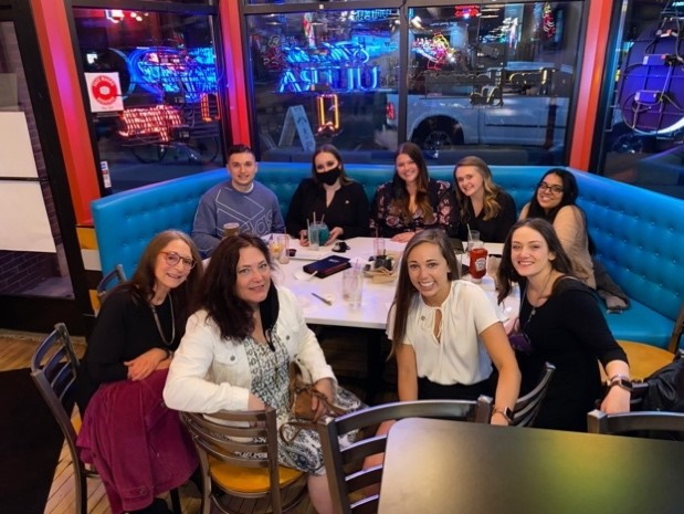 a group of people sitting at a table