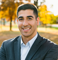 a person in a suit smiling