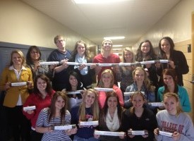 Center for Sport and Performance Psychology students and instructor posing for a class photo in the hallway