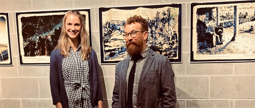 Haylee Blauert and Jason Jasperson in front of artwork from The book their authored and illustrated called "The Stars in the Sky" 
