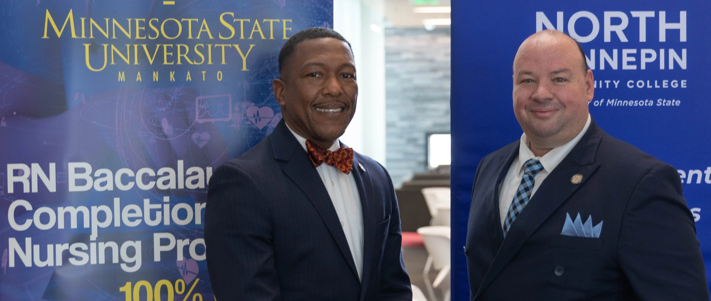 David Hood on the left side, Minnesota State University, Mankato's provost and senior vice president for academic affairs, and Rolando Garcia on the right side, North Hennepin Community College's president, are pictured at a Jan. 11, 2023 ceremony in Brooklyn Park, Minnesota