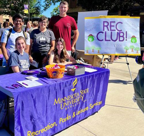 Students at the campus mall with a table promoting Rec Club