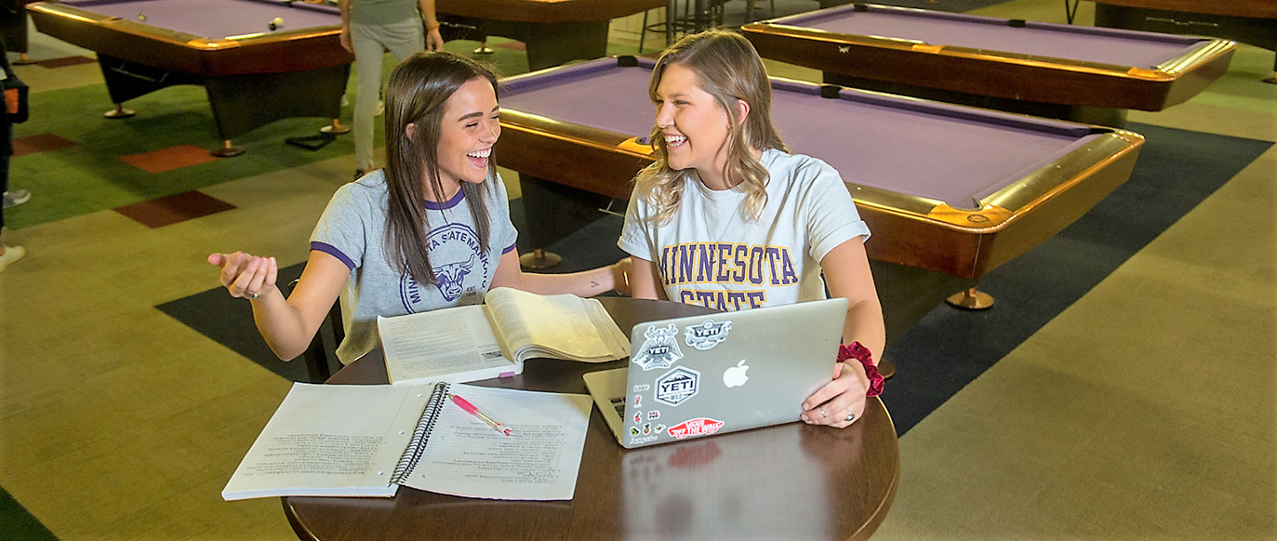 Two Recreation Leadership and Management students working together in bullpen.