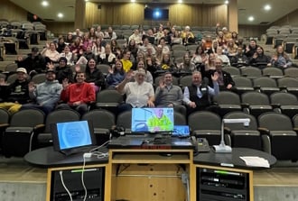 View from speaker of an audience with theater style seating