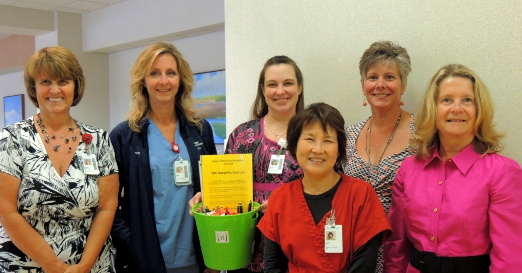 Group of people standing in a clinical setting