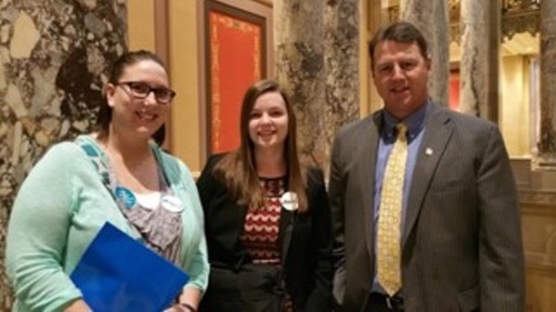 Students posing with State Senator Nick Frentz at the state capital