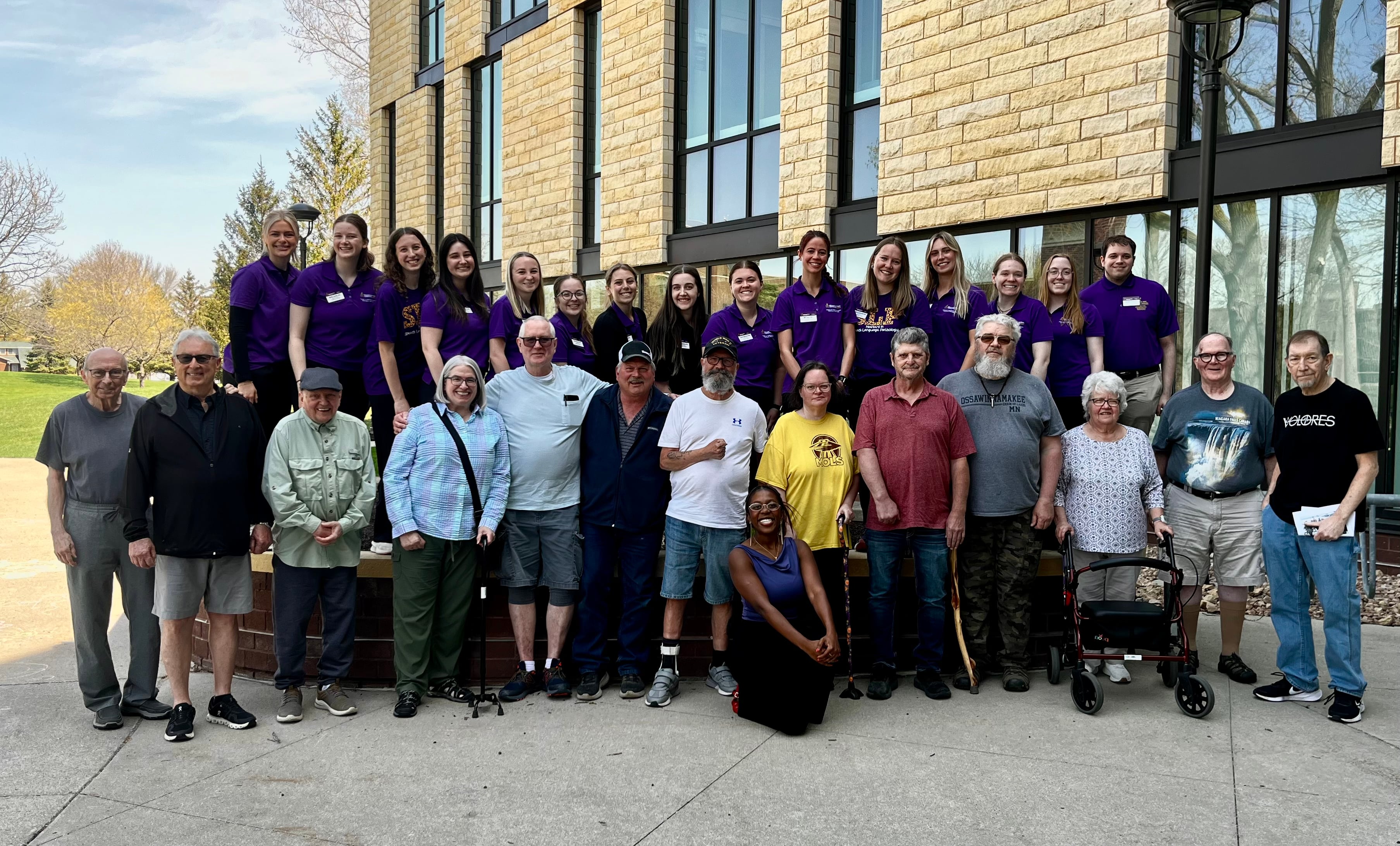 Aphasia group photo of participants posing outside of Minnesota State Mankato