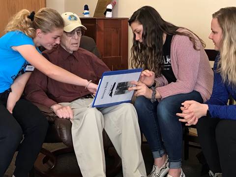 Students with Memory Book Program participant