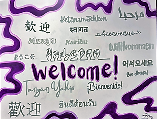Purple and white welcome sign in multiple languages.