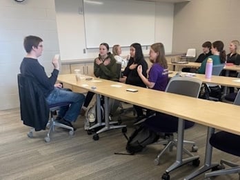 Sign language students in a classroom