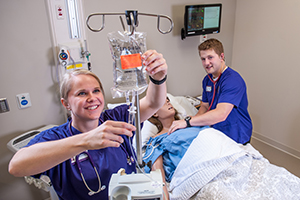 Nursing students with patient