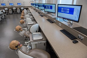 The Dental Simulation Lab with a simulator, computer and monitor at each station