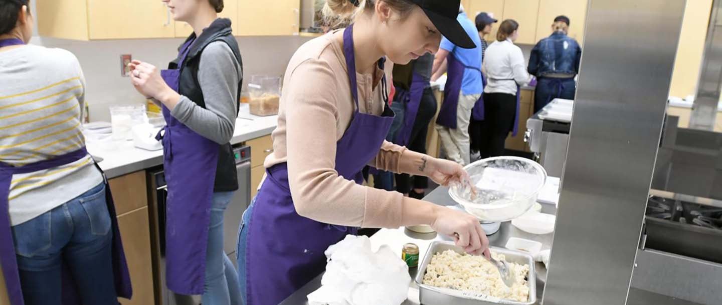 Students of Family Consumer Science in the food lab preparing different meals